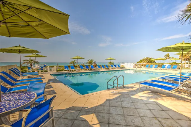 a view of swimming pool with outdoor seating