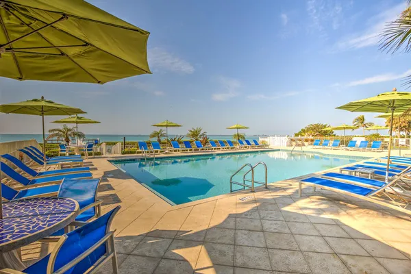 a view of swimming pool with outdoor seating