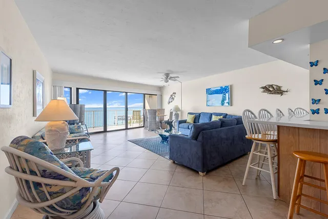 a living room with furniture a window and a table
