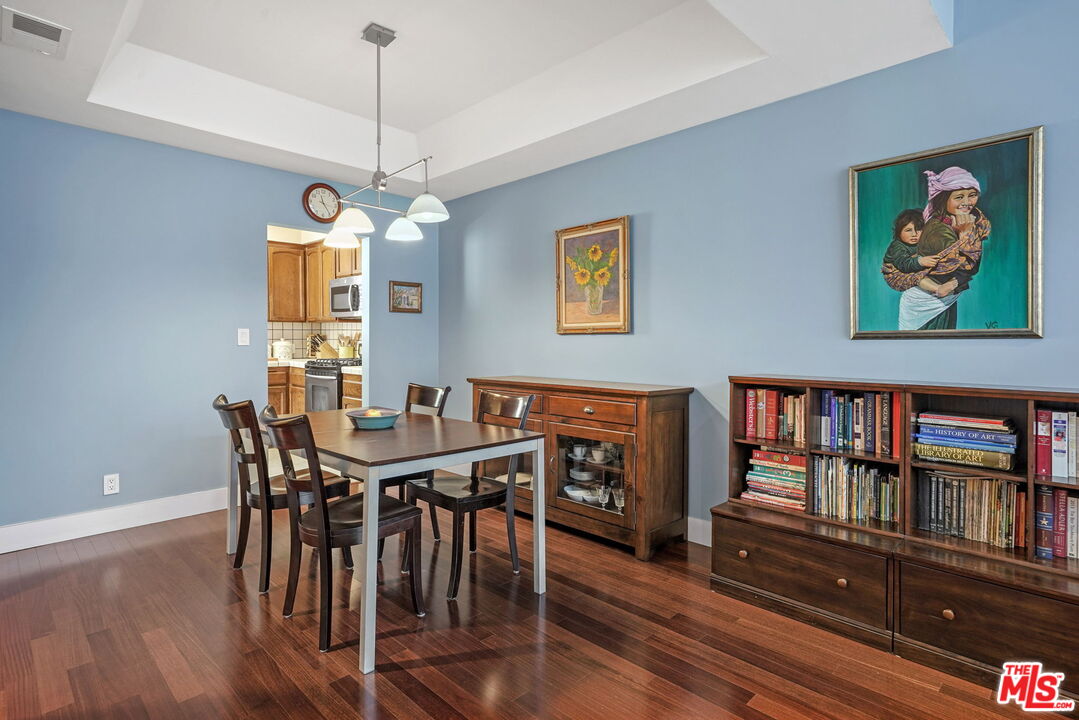 3544 Keystone Avenue, Unit 4 Los Angeles, CA 90034 - Photo 9 of 28 a view of a dining room with furniture wooden floor and a window