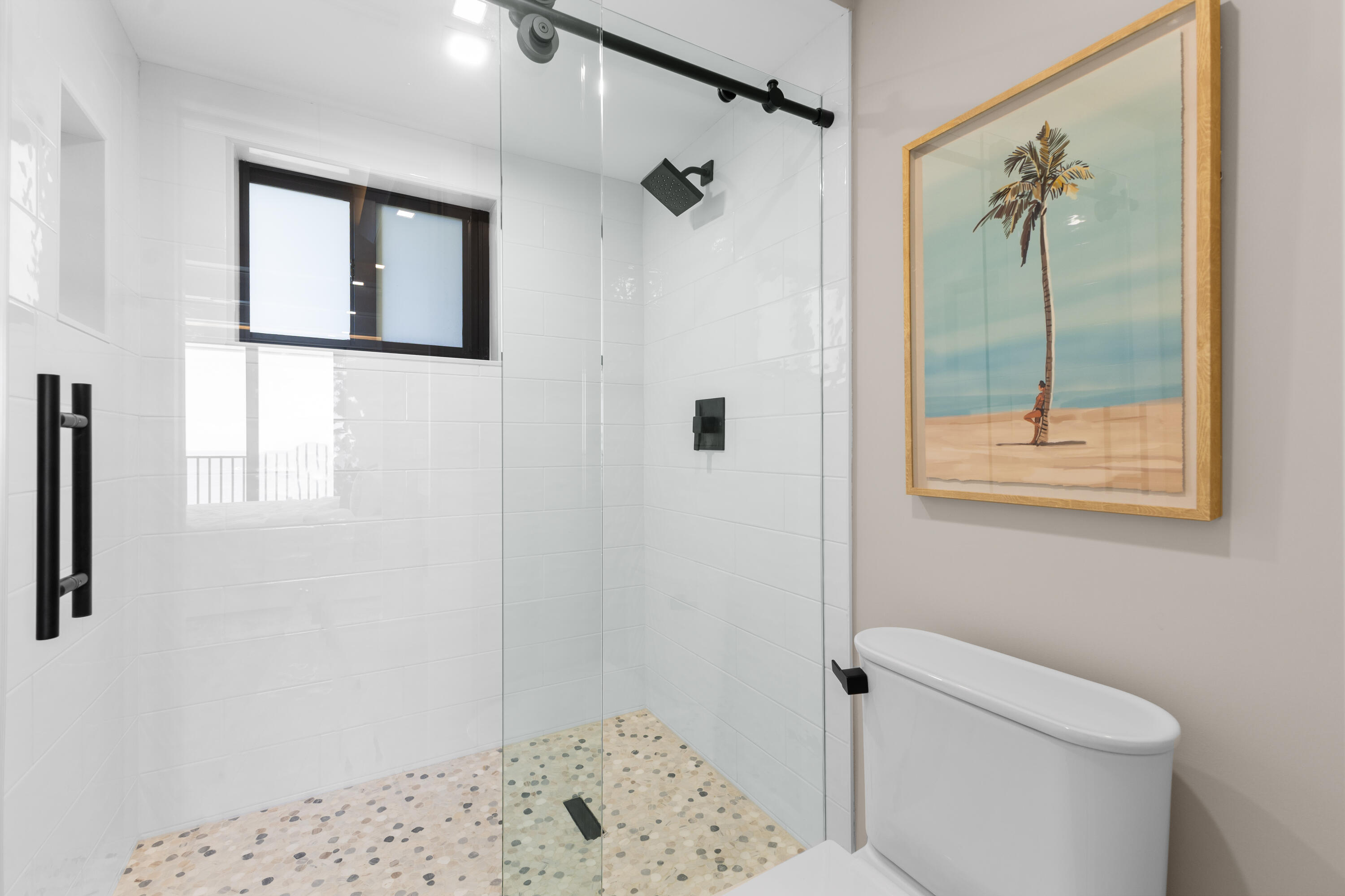 400 Ocean Trail Way, Unit 1008 Jupiter, FL 33477 - Photo 15 of 25 a bathroom with a shower and a toilet