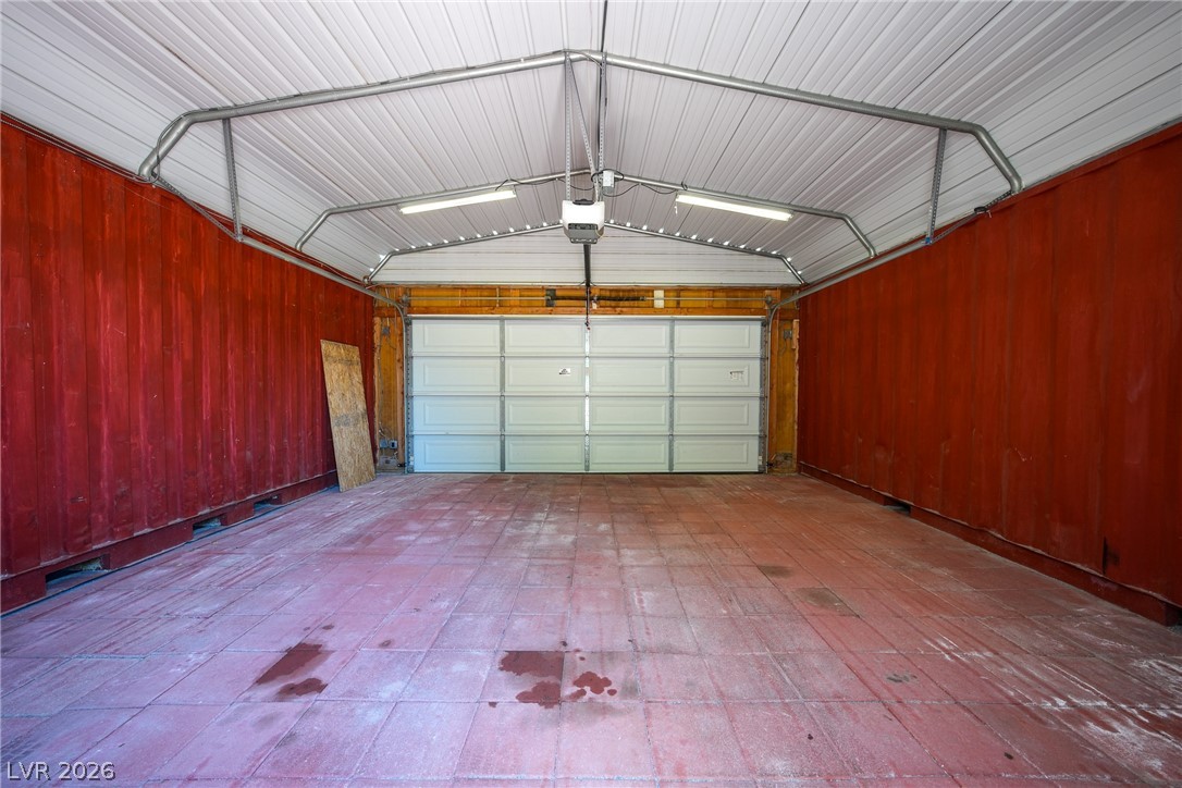 1831 West Horn Road Pahrump, NV 89048 - Photo 44 of 59 Secure, detached garage with metal siding and a durable concrete slab floor.