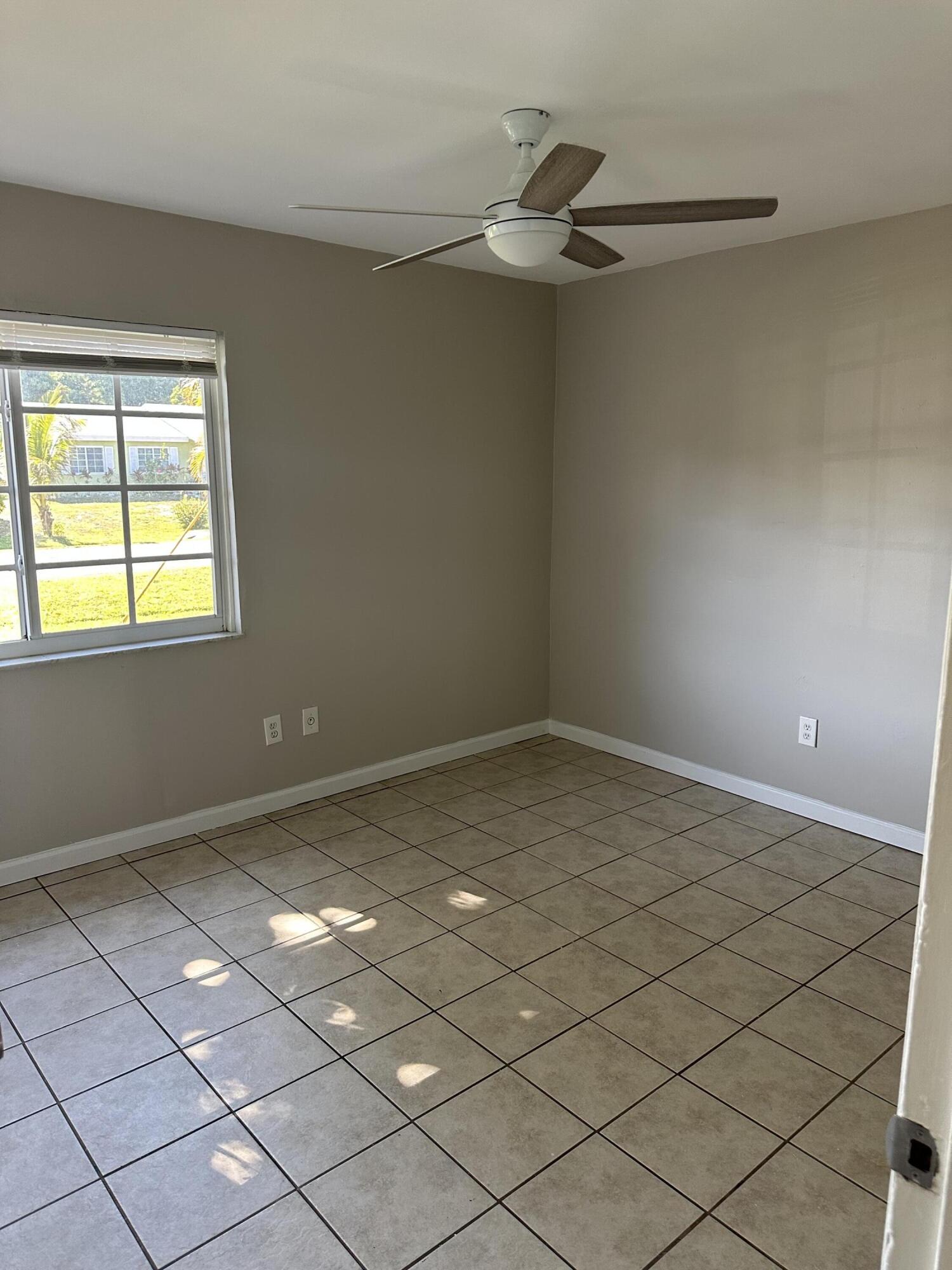 377 Southwest Cherryhill Road Port St. Lucie, FL 34953 - Photo 5 of 9 a view of a room with a window