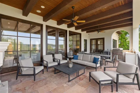 a living room with furniture tv and a large window