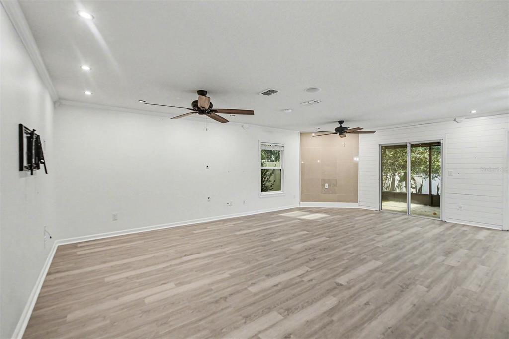 111 Lakeside Court Bunnell, FL 32110 - Photo 12 of 27 wooden floor in an empty room with a window
