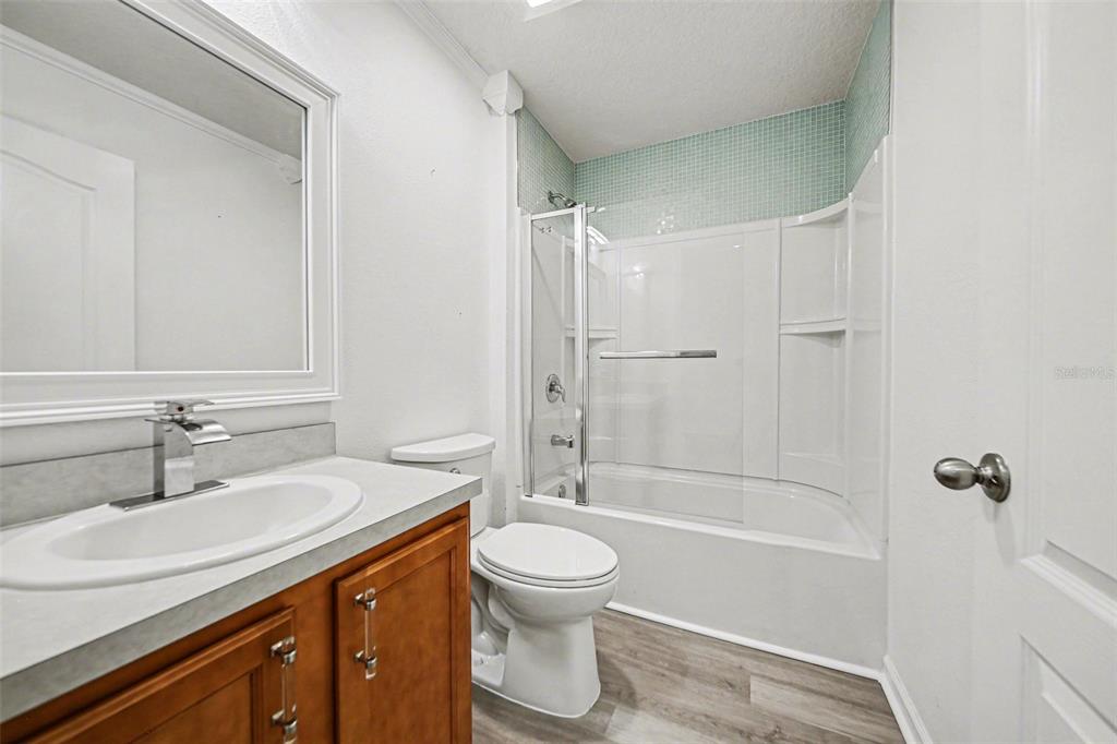 111 Lakeside Court Bunnell, FL 32110 - Photo 15 of 27 a bathroom with a sink a toilet and shower