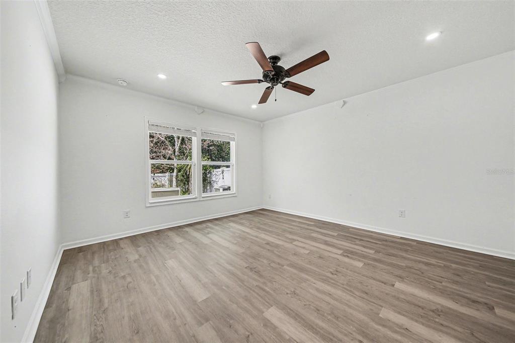111 Lakeside Court Bunnell, FL 32110 - Photo 16 of 27 wooden floor in an empty room with a window