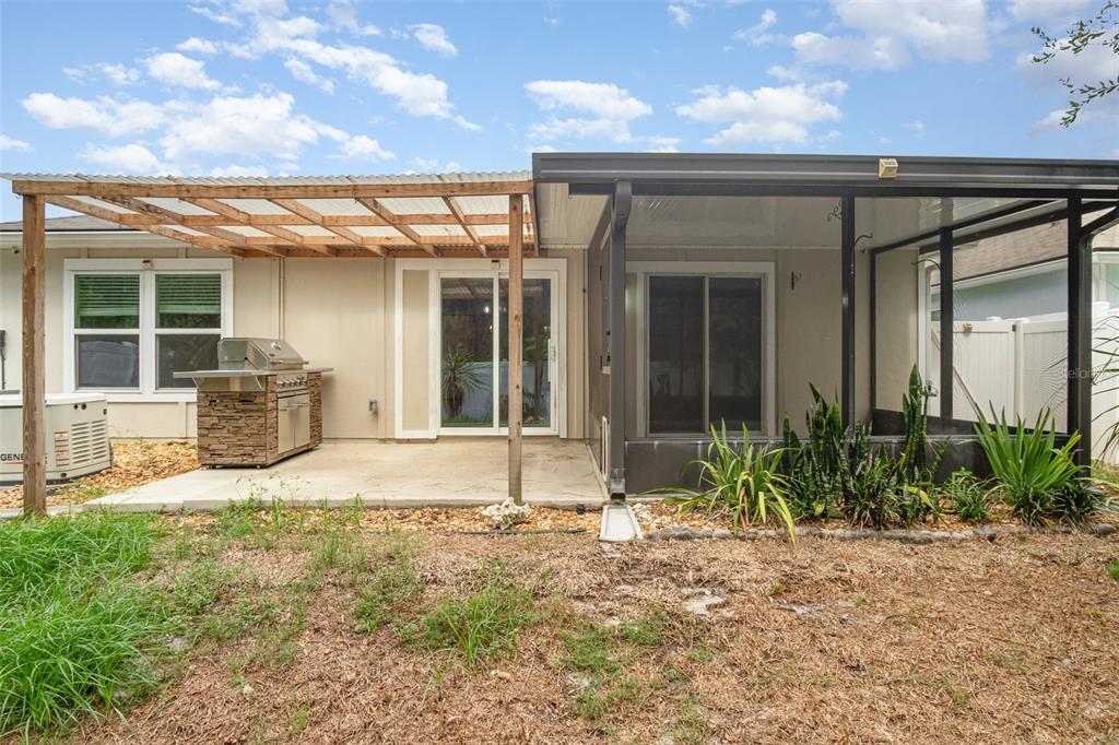 111 Lakeside Court Bunnell, FL 32110 - Photo 27 of 27 a view of a house with backyard and porch