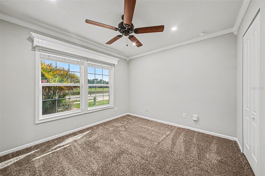 111 Lakeside Court Bunnell, FL 32110 - Photo 9 of 27 a view of a livingroom with a ceiling fan and window