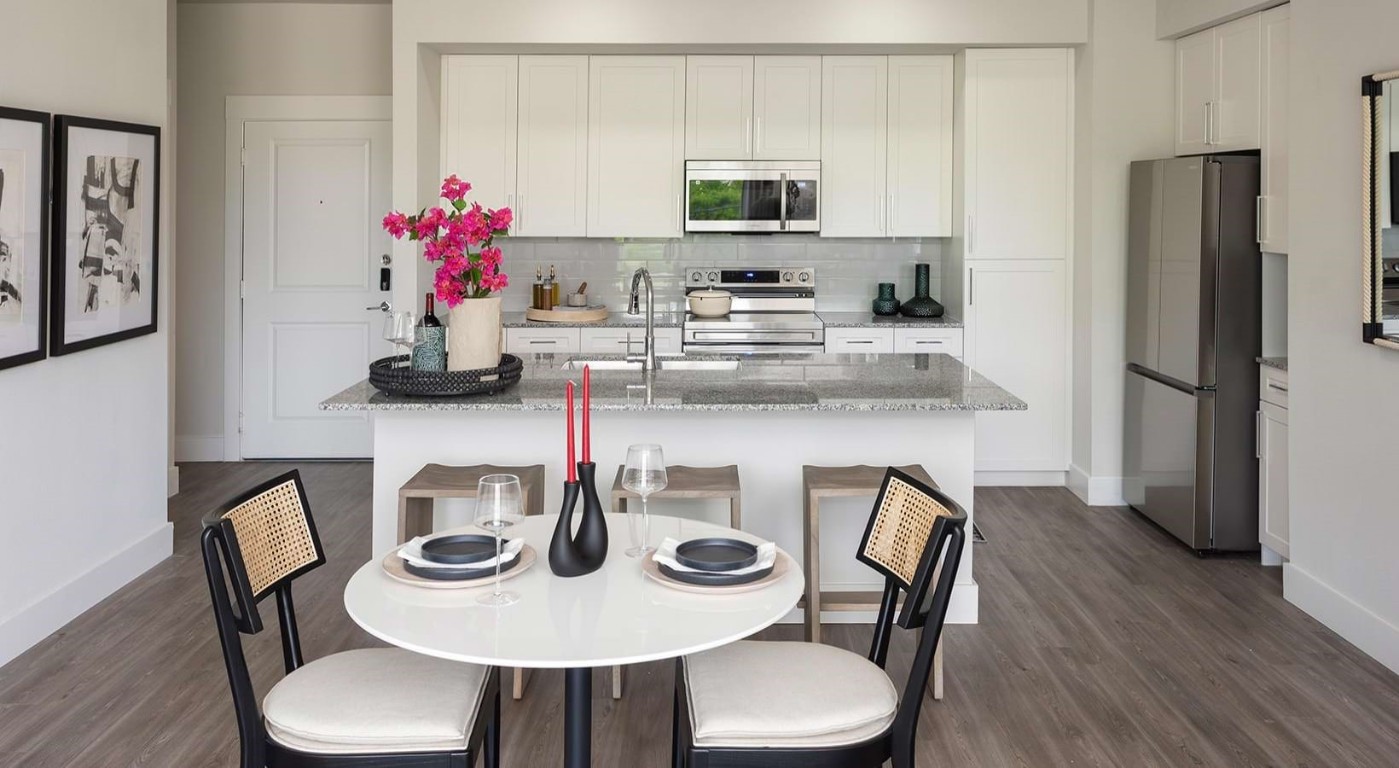 2425 Bell Street, Unit 1355 Houston, TX 77003 - Photo 3 of 30 a view of a dining room with furniture and wooden floor