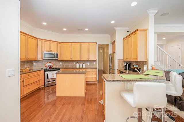 a bathroom with a double vanity sink mirror and toilet