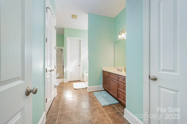 a view of a brick house with a yard