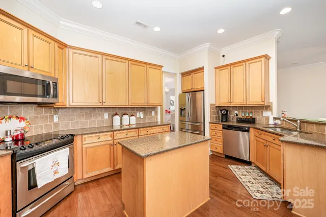 a bedroom with furniture and a flat screen tv