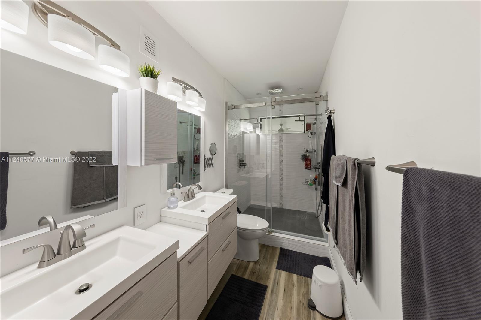 19760 Southwest 242nd Terrace Homestead, FL 33031 - Photo 15 of 49 a bathroom with a double vanity sink toilet and shower