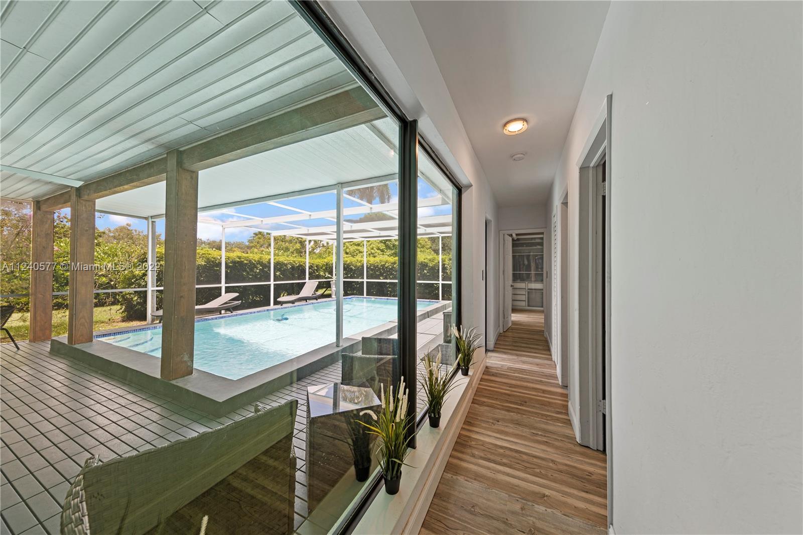 19760 Southwest 242nd Terrace Homestead, FL 33031 - Photo 16 of 49 a view of a patio with wooden floor and iron stairs