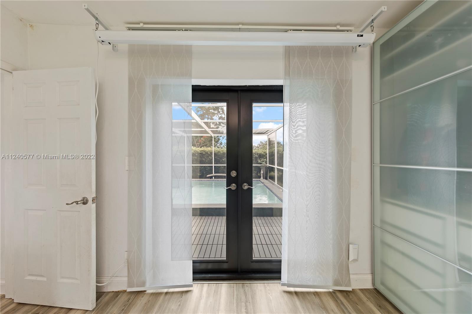 19760 Southwest 242nd Terrace Homestead, FL 33031 - Photo 18 of 49 a view of entryway with wooden floor