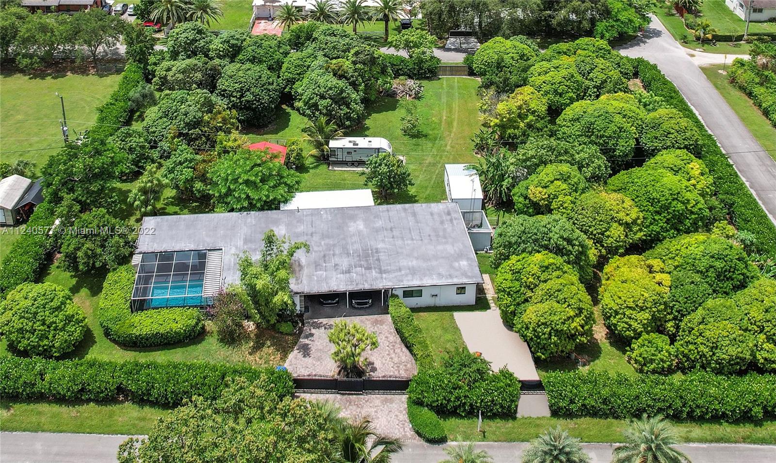 19760 Southwest 242nd Terrace Homestead, FL 33031 - Photo 2 of 49 an aerial view of a house with a garden