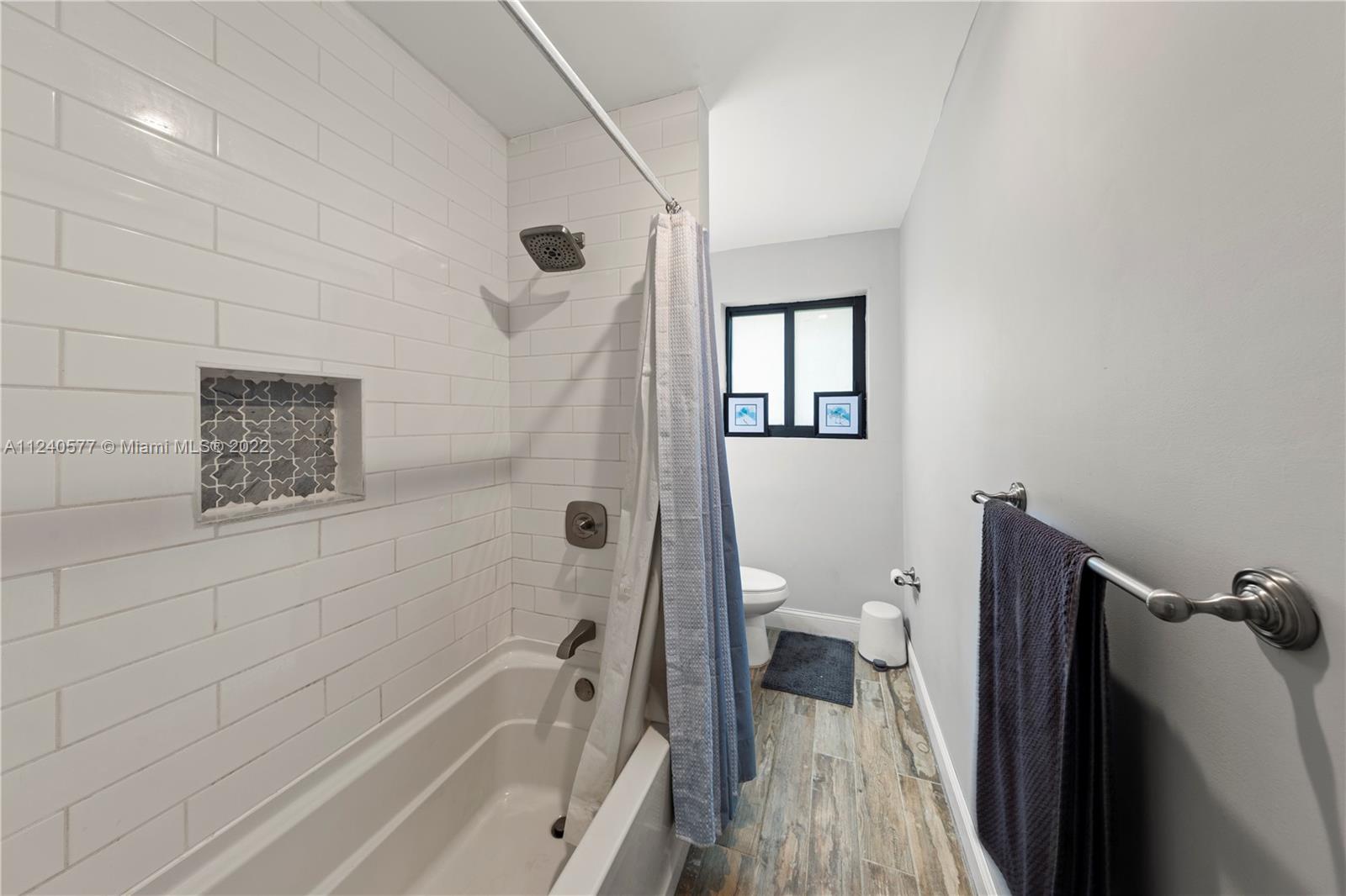 19760 Southwest 242nd Terrace Homestead, FL 33031 - Photo 21 of 49 a bathroom with a bathtub and a toilet