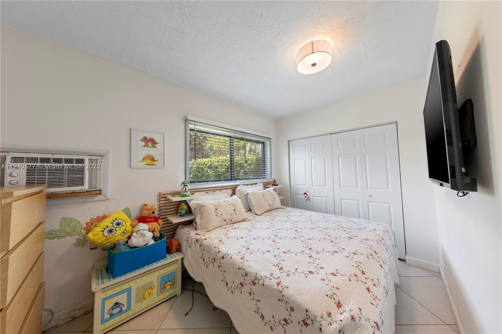 19760 Southwest 242nd Terrace Homestead, FL 33031 - Photo 33 of 49 a bedroom with bed and a window