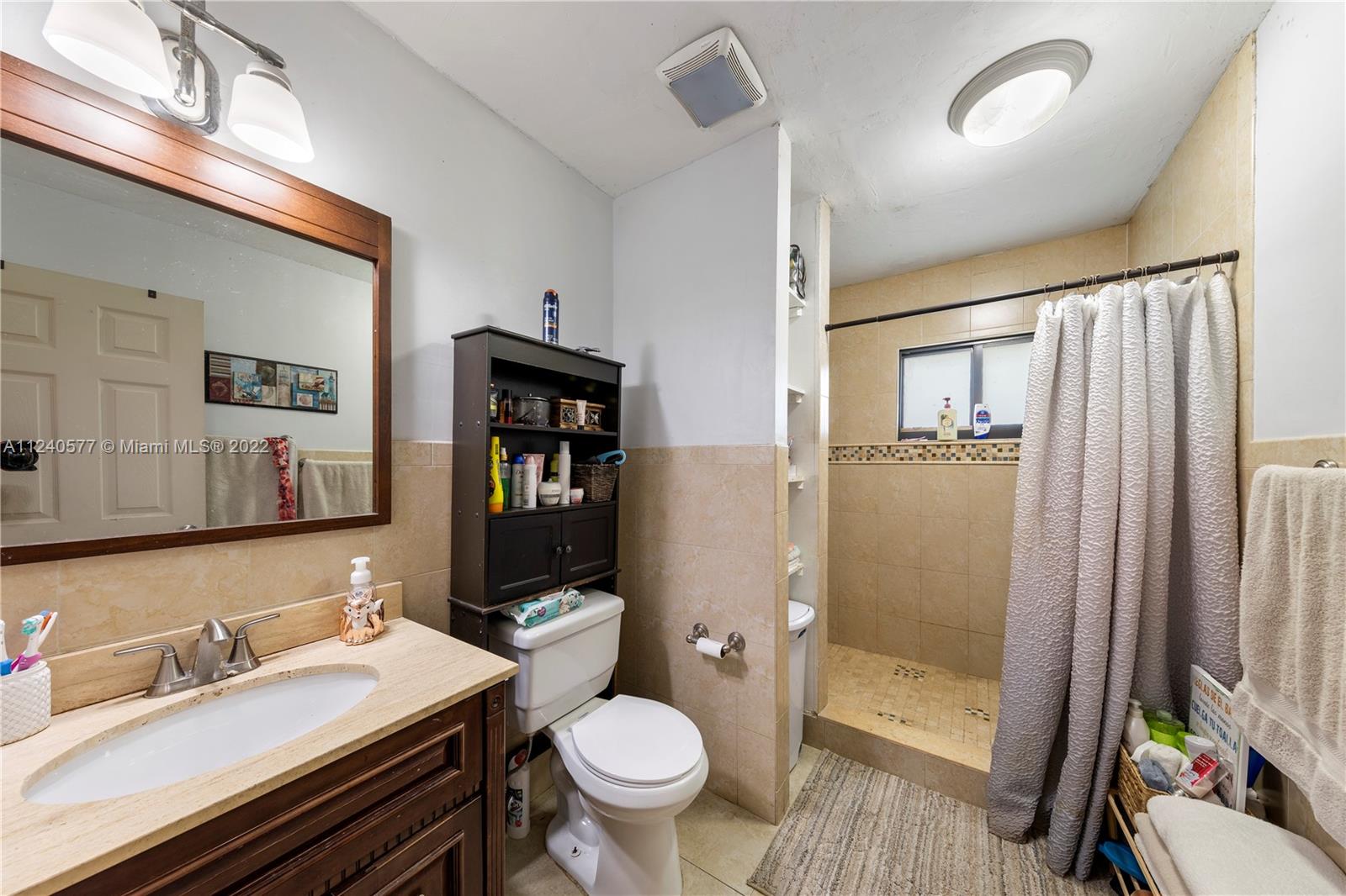 19760 Southwest 242nd Terrace Homestead, FL 33031 - Photo 34 of 49 a bathroom with a sink toilet and shower