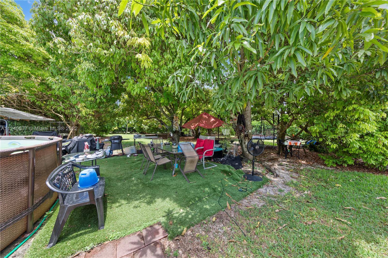 19760 Southwest 242nd Terrace Homestead, FL 33031 - Photo 35 of 49 a view of a backyard with sitting area