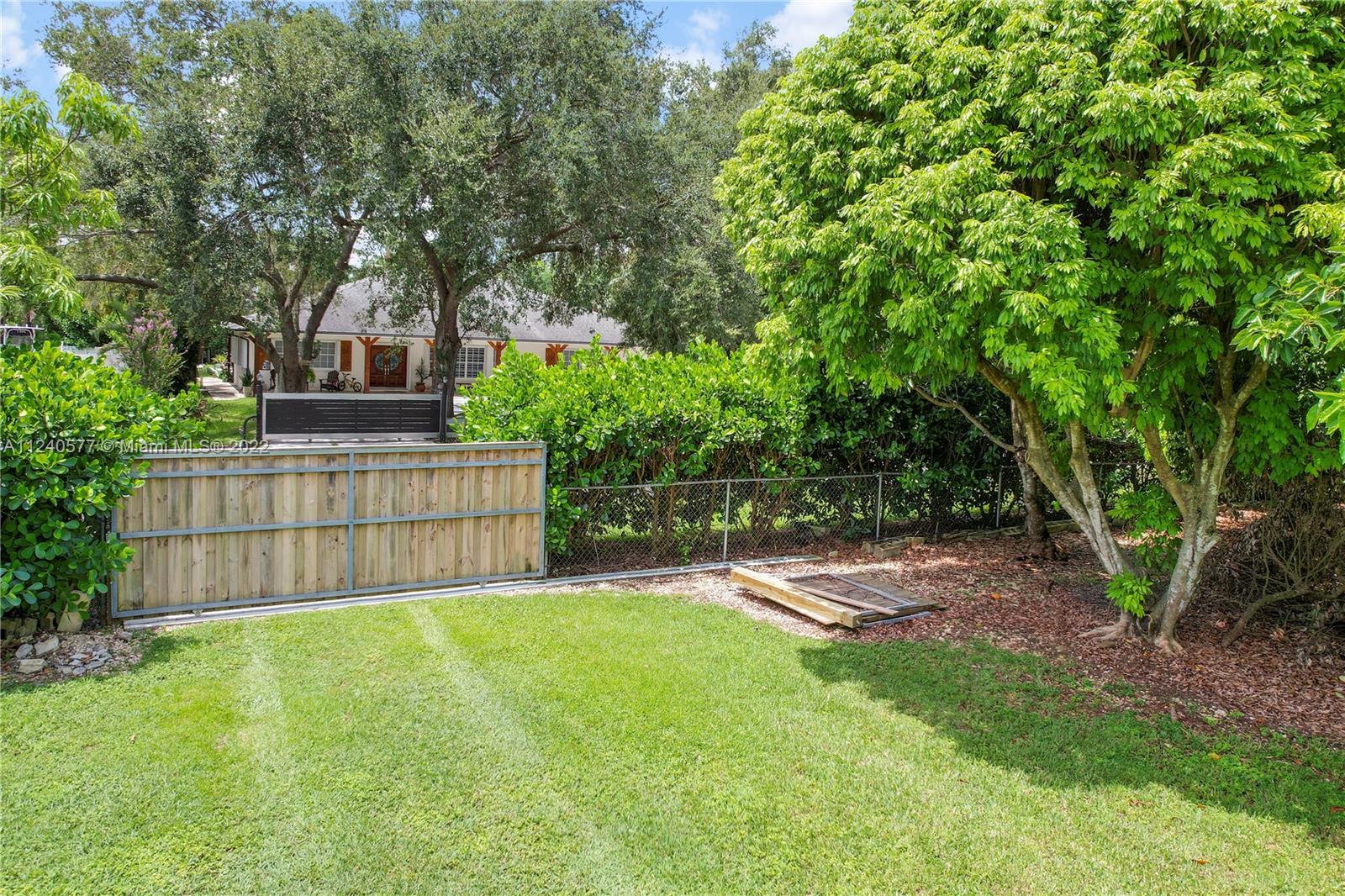 19760 Southwest 242nd Terrace Homestead, FL 33031 - Photo 38 of 49 a view of a backyard with a garden