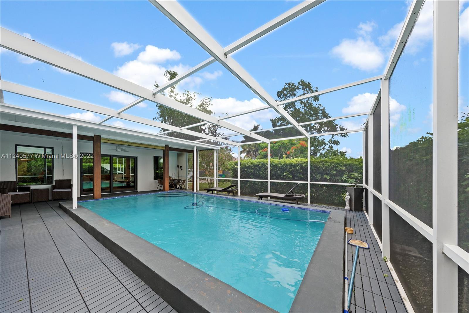 19760 Southwest 242nd Terrace Homestead, FL 33031 - Photo 4 of 49 a view of a swimming pool with a patio