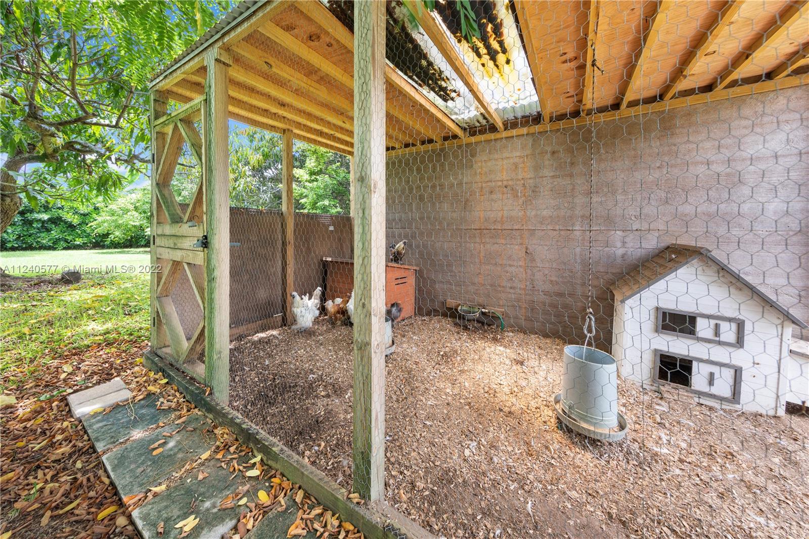 19760 Southwest 242nd Terrace Homestead, FL 33031 - Photo 41 of 49 a view of a house with a yard