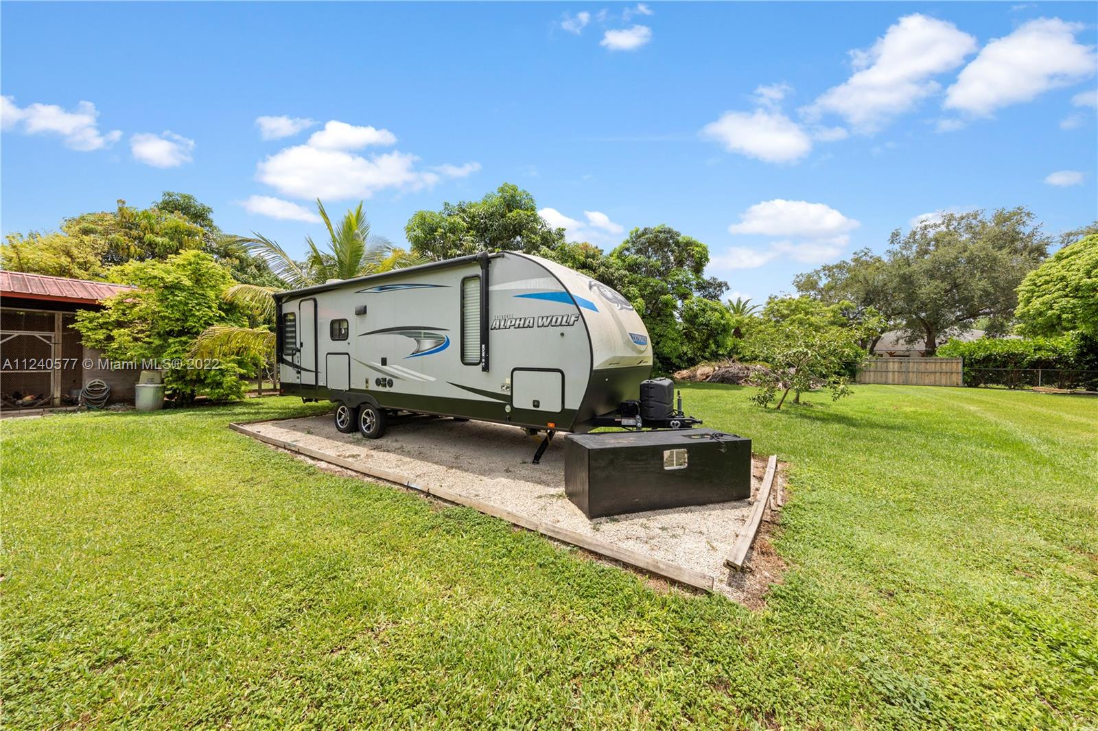 19760 Southwest 242nd Terrace Homestead, FL 33031 - Photo 48 of 49 a swimming pool with outdoor seating and yard