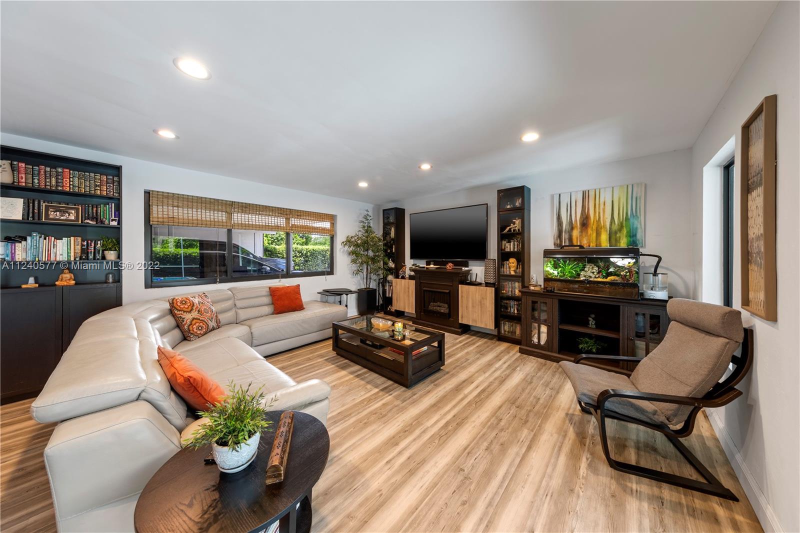 19760 Southwest 242nd Terrace Homestead, FL 33031 - Photo 8 of 49 a living room with furniture and a flat screen tv