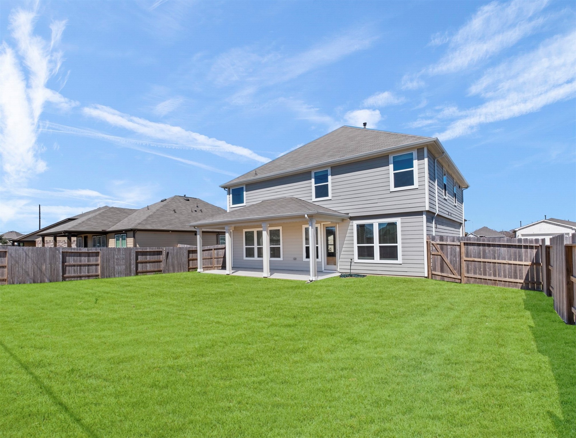 5712 Bluebonnet Lane Rosenberg, TX 77469 - Photo 16 of 16 a view of a house with a yard and sitting area