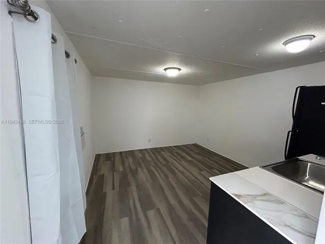 a view of kitchen with a sink