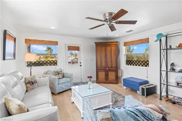 a kitchen with stainless steel appliances granite countertop a refrigerator sink and stove