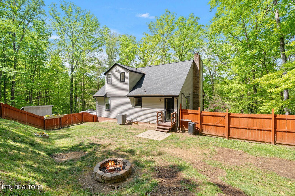 8908 Ellis Lane Powell, TN 37849 - Photo 2 of 37 a view of a house with backyard and sitting area