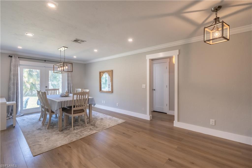 2237 Kings Lake Boulevard Naples, FL 34112 - Photo 15 of 49 a view of a dining room with furniture and window