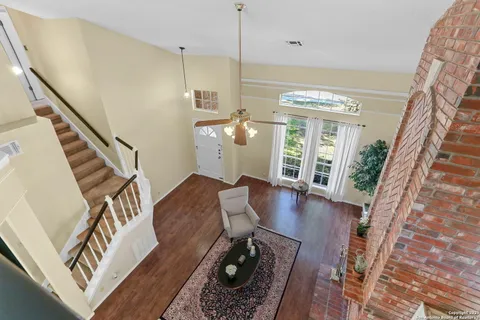 a view of an entryway with wooden floor
