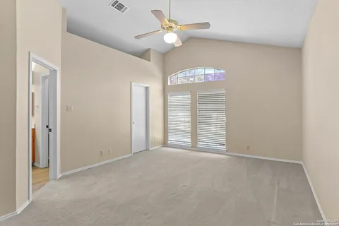 a view of an empty room with a window