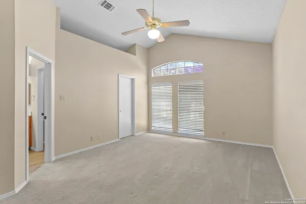 a outdoor living space with furniture and a ceiling fan