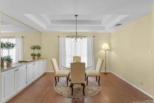 a view of a dining room with furniture and window