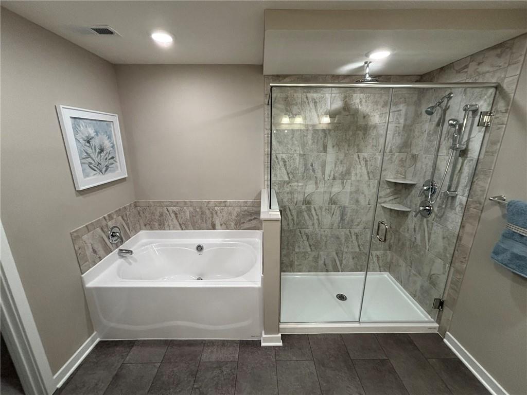 160 Raphael Court Clinton, PA 15026 - Photo 15 of 19 a bathroom with a bathtub and a shower