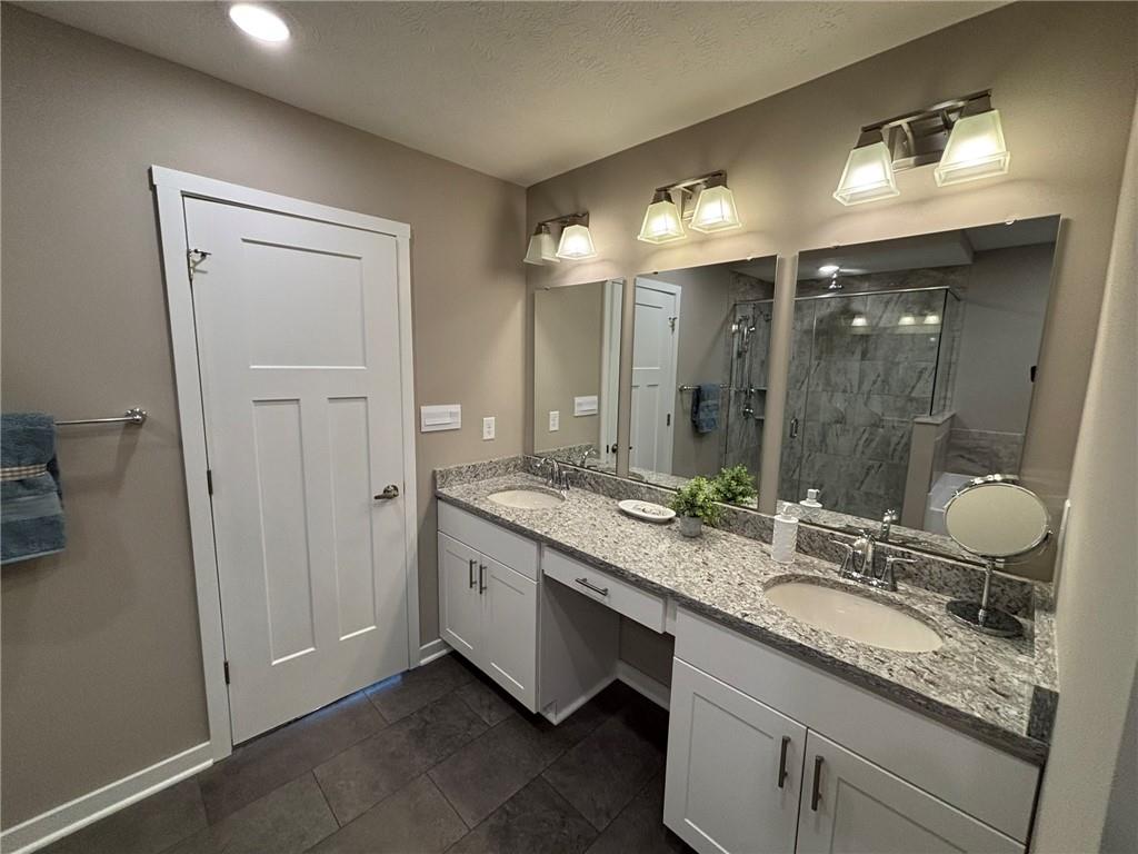 160 Raphael Court Clinton, PA 15026 - Photo 16 of 19 a bathroom with a granite countertop sink mirror and double