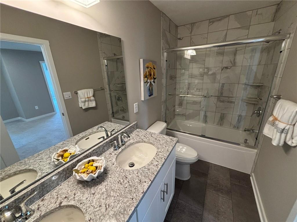 160 Raphael Court Clinton, PA 15026 - Photo 19 of 19 a bathroom with a granite countertop sink a toilet and shower