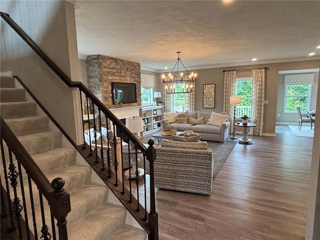 160 Raphael Court Clinton, PA 15026 - Photo 6 of 19 a view of a livingroom with furniture hardwood floor and chandelier