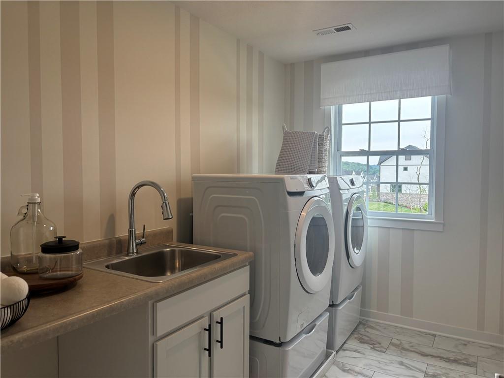 160 Raphael Court Clinton, PA 15026 - Photo 9 of 19 a utility room with dryer and washer