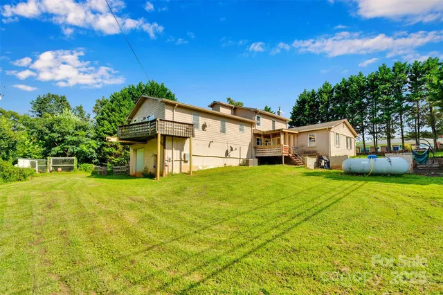 a front view of a house with a big yard