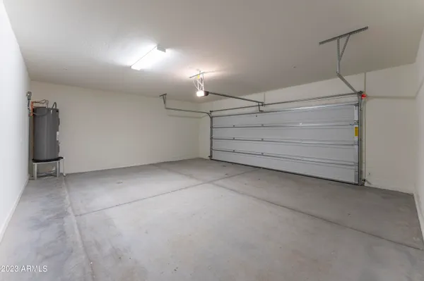 an empty room with closet and a bathroom