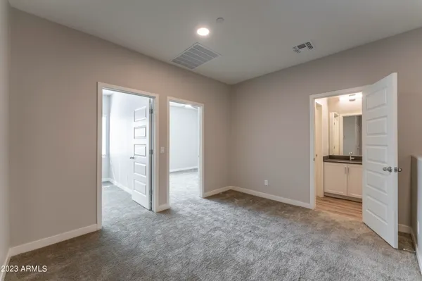 a white toilet sitting next to a shower