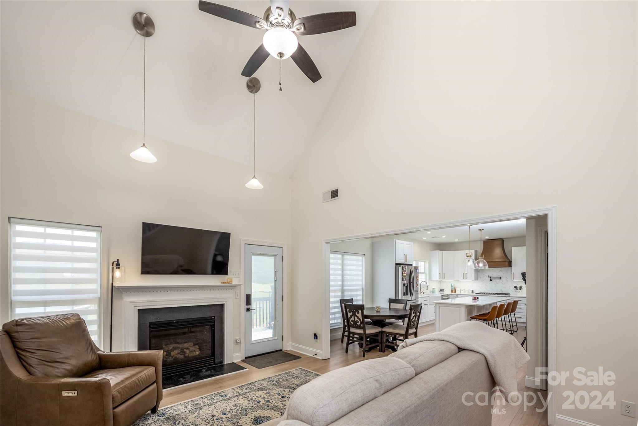 395 Hoover Road Troutman, NC 28166 - Photo 7 of 26 a living room with furniture fireplace and flat screen tv