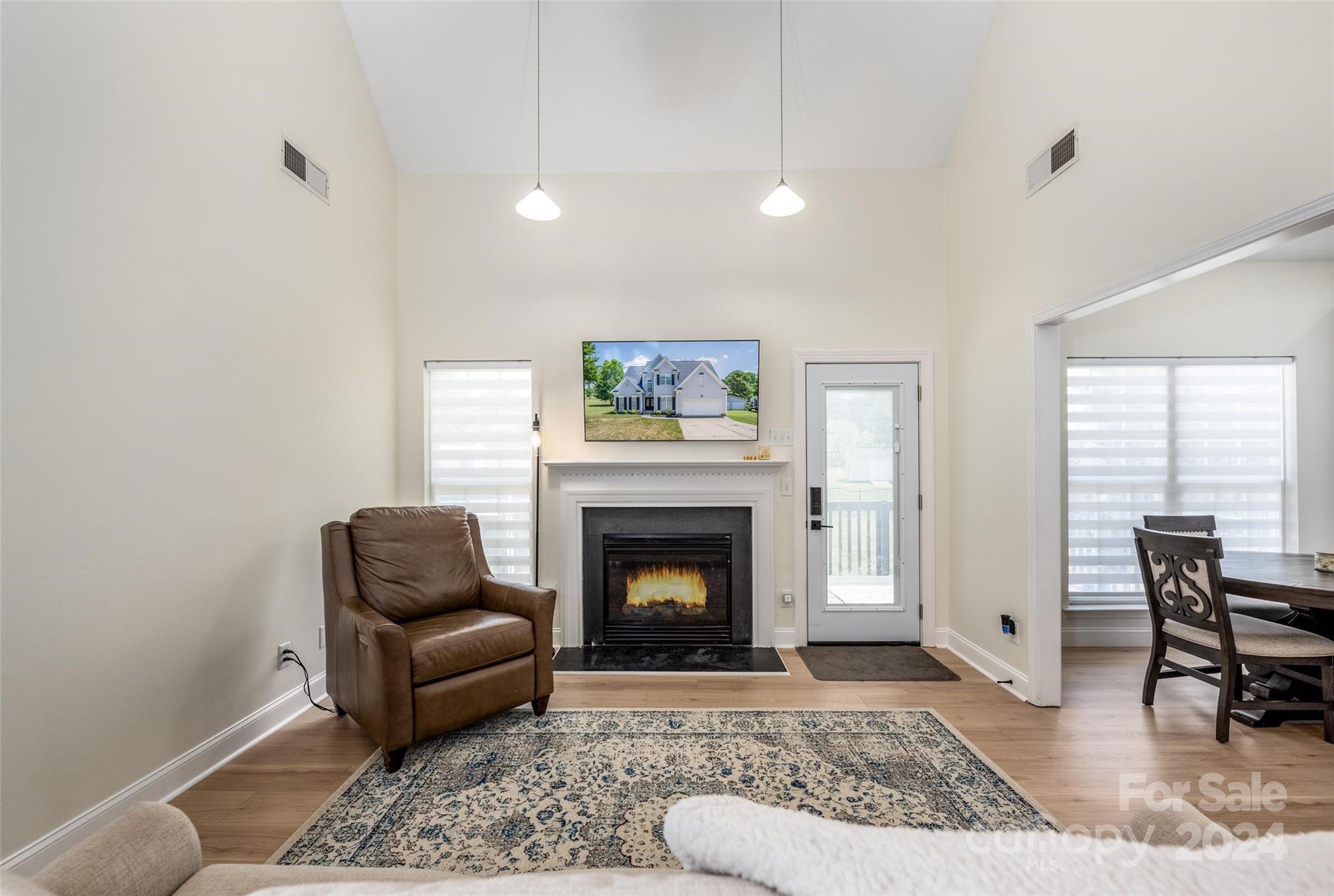 395 Hoover Road Troutman, NC 28166 - Photo 8 of 26 a living room with furniture and a fireplace