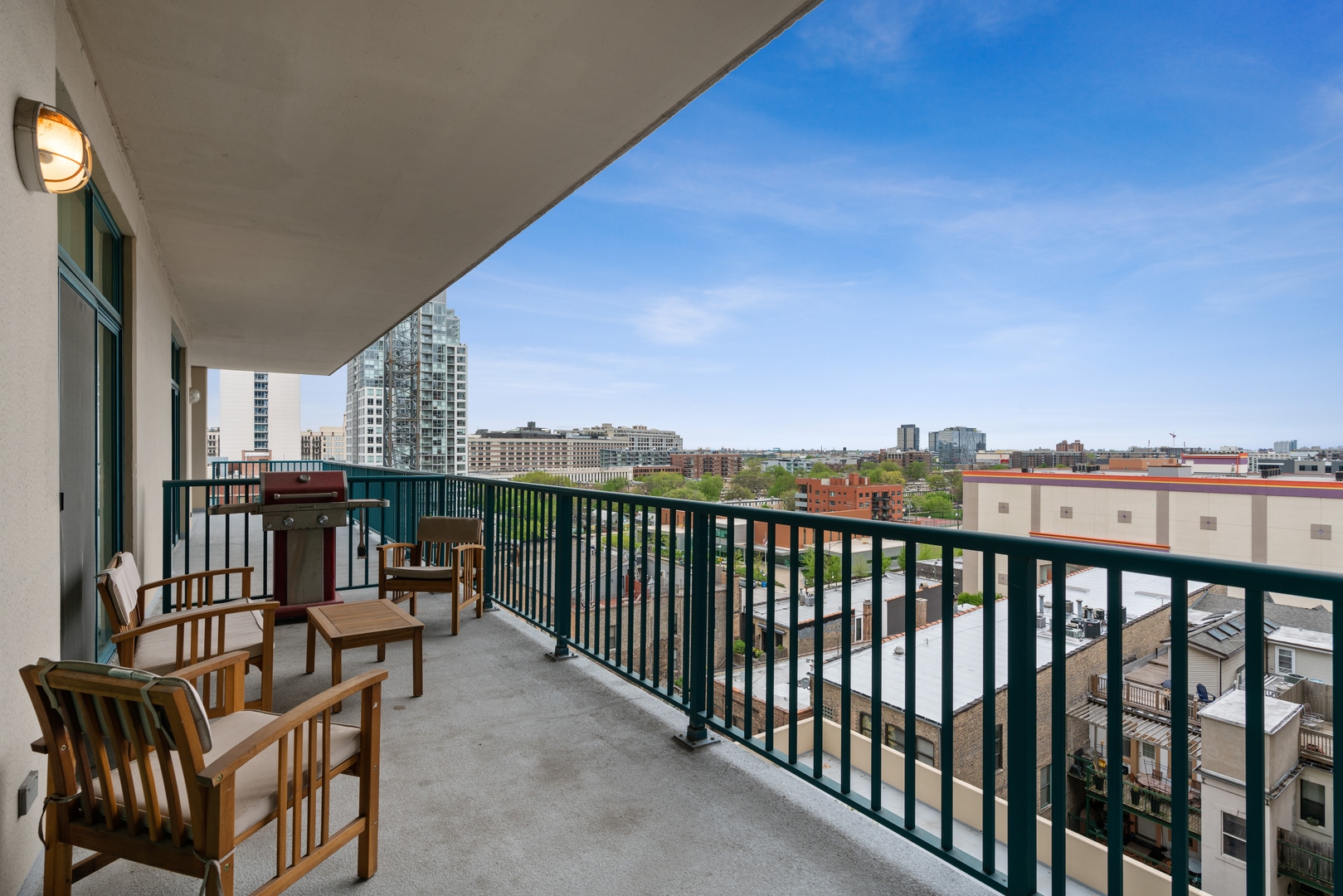 340 West Superior Street, Unit 910 Chicago, IL 60654 - Photo 9 of 10 a view of a balcony with furniture